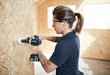 Female using a Festool drill on a wooden panel