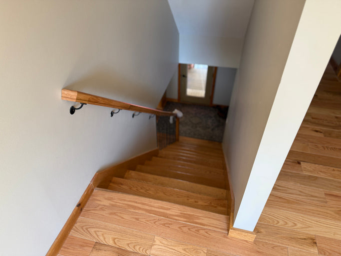 Wooden staircase with handrail in a home interior